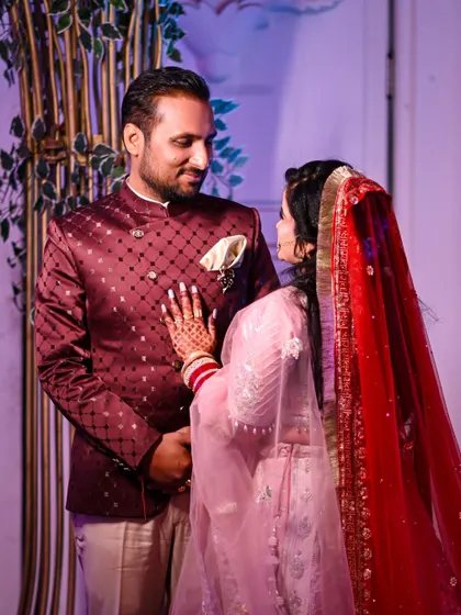 A sweet, candid moment where the bride places her hand on the groom's chest. It's a simple gesture full of love and connection, which I always look for during a wedding shoot.