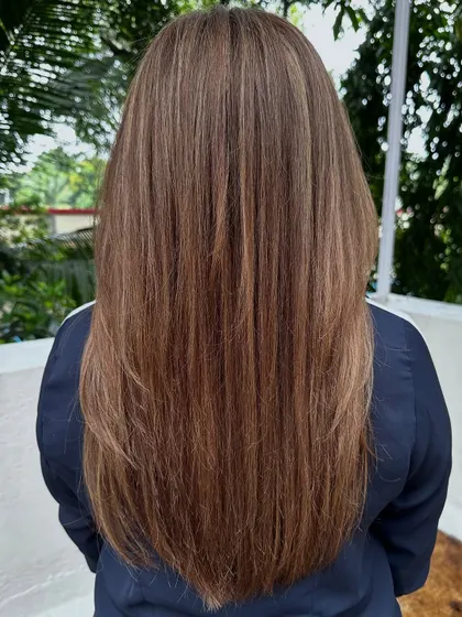 Another view of the ash blonde, showing how sleek and healthy the hair looks.
