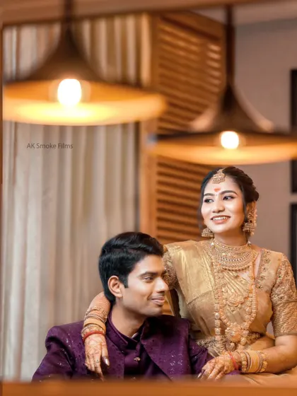 A creative reflection shot that gives a clear view of the bride's beautiful gold wedding jewelry.