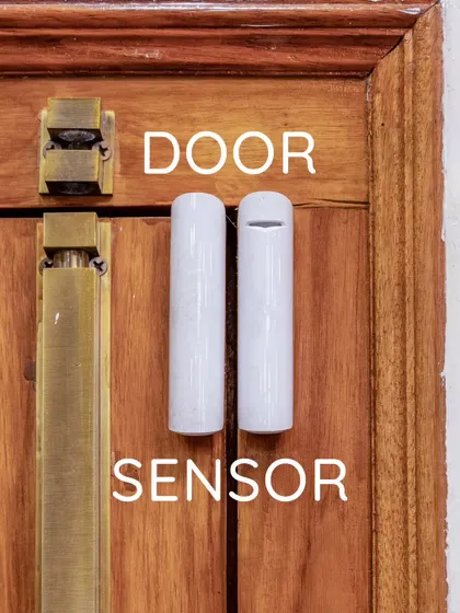 This image shows a door sensor, a core component of any security system. This simple magnetic device detects when a door or window is opened and can trigger an alarm or send a notification.