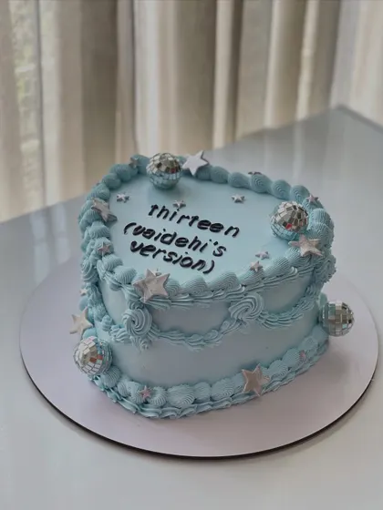 A closer look at the Taylor Swift inspired heart-shaped cake, perfect for a 13th birthday celebration.