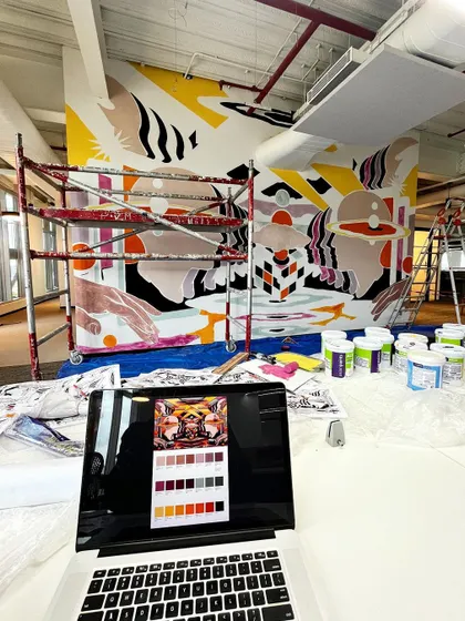 A behind-the-scenes look at the painting process. Here you can see the color-blocking stage, with my laptop showing the digital reference and color palette.