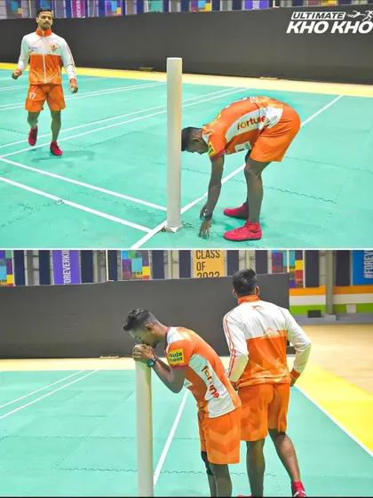A moment of reverence. Deepak Madhav pays respect to the pole before starting his game, a tradition that connects the professional stage back to the roots of the sport.