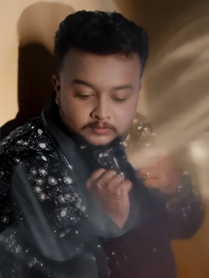 A creative portrait of the groom with a soft, dreamy light effect.
