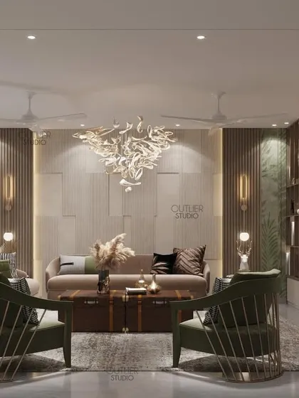 Home is where the heart is. This living room combines comfortable seating with a stunning sculptural chandelier and touches of green, creating a space that is both stylish and welcoming.