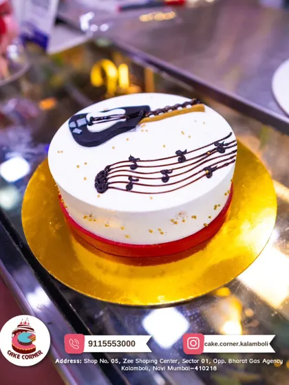 A simple and elegant guitar cake. The clean design with a guitar and musical notes is a great choice for someone who loves to play music.