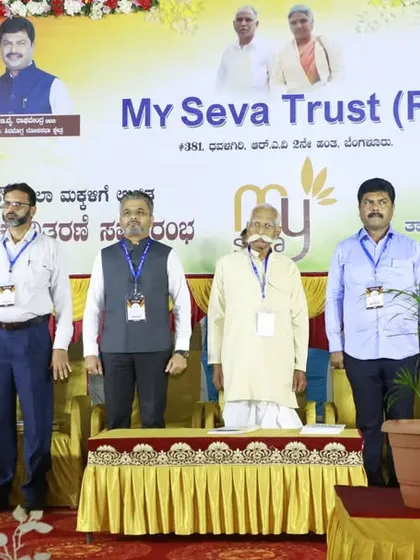 The full lineup of organizers and supporters on stage, a team dedicated to the cause of education.