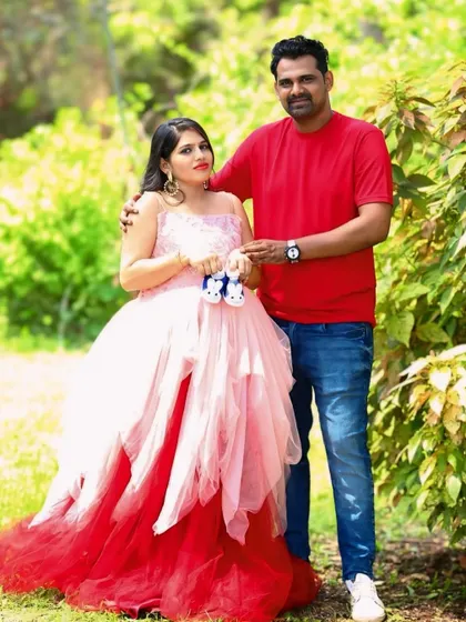 This unique asymmetric gown features layers of peach and red net, creating a beautiful ombre effect. It's a playful and colorful option for an outdoor shoot.