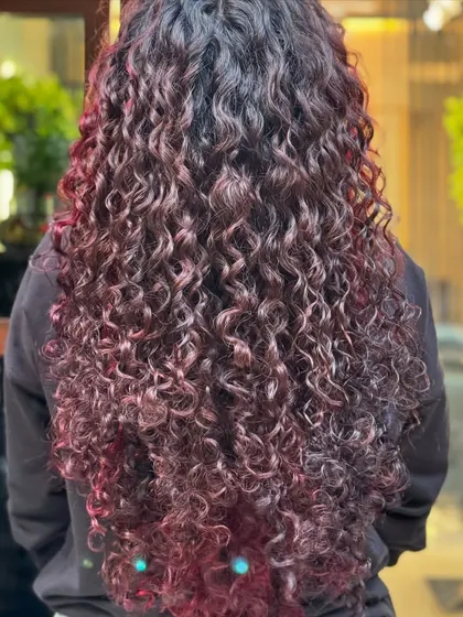 On longer hair, a red balayage creates a beautiful, flowing cascade of color.