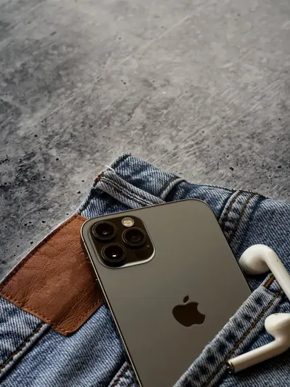 This is one of my favorites from the series. The iPhone and AirPods are casually tucked into the pocket of a pair of jeans, creating a cool, effortless, and relatable lifestyle image.