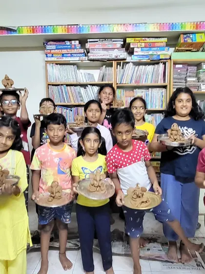 Look at these proud faces! During our festive workshops, children get to connect with culture through creativity. Here, a group of young artists proudly shows off the eco-friendly Ganesha idols they sculpted with their own hands.