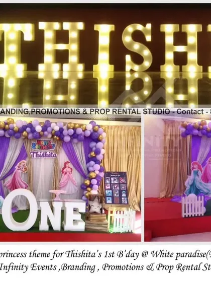 We created this simple and elegant princess theme for a first birthday at White Paradise hall. The decor uses a white curtain backdrop with a purple and gold balloon garland, a "ONE" table, and marquee letters to create a beautiful and classic look.