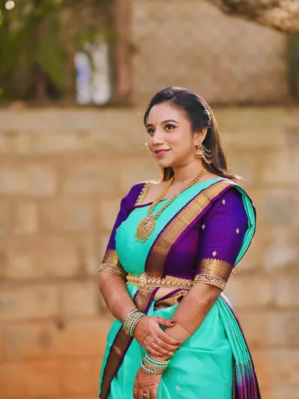 A lovely portrait from her Varpooja, showcasing the soft glam makeup that complements her turquoise and purple saree.