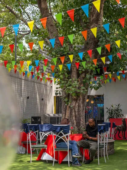 Our outdoor seating area is perfect for parents to relax while the kids celebrate. The colorful bunting adds a festive touch to any birthday party.