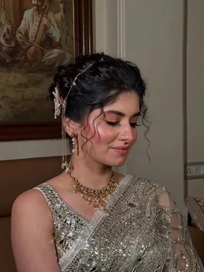 This angle highlights the soft tendrils I left out to frame the face, adding a touch of softness to the structured updo.