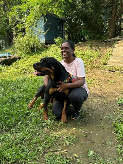 I'm comfortable and experienced with dogs of all sizes and breeds. Here I am with a beautiful Rottweiler during my training internship. My approach is always built on respect and understanding the individual needs of each dog, no matter their size or strength.