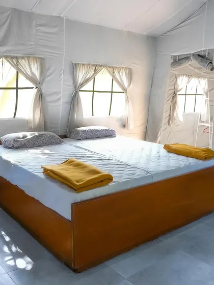 A clean and prepared bedroom inside one of our Swiss cottages.