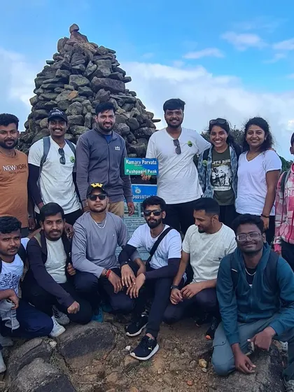 A group of friends at the Kumara Parvatha summit. Conquering this peak together is a bonding experience like no other.