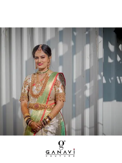 A beautiful portrait of Rishika, her smile as radiant as her ensemble. The finesse of the blouse embellishments and the overall composure of her look are simply stunning.