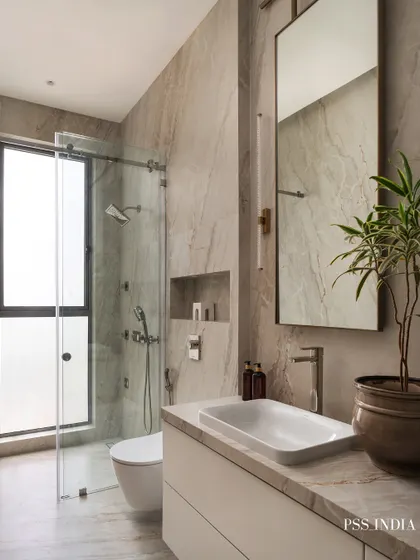 This bathroom is a serene sanctuary. I used marble-look tiles, a sleek vessel sink, and warm lighting to create a space that feels both minimalist and full of character. The addition of a plant brings a touch of nature indoors.