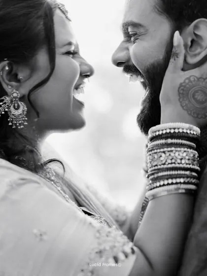 A duplicate of image 18, capturing a beautiful moment of shared laughter in monochrome.