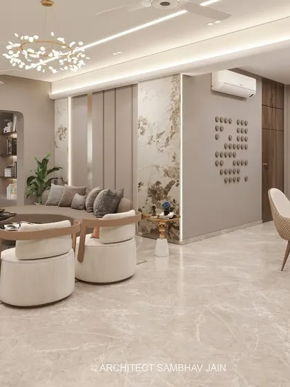 This living room is a celebration of calm, curated design, where neutral hues and handpicked artifacts come together in perfect balance. A soothing palette of soft beige, taupe, and warm greys forms the foundation, allowing textures and materials to shine.