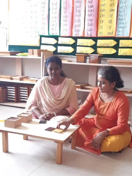 An educator from Senthil Public School presents a sensorial activity, showcasing her understanding of how to guide a child's exploration.
