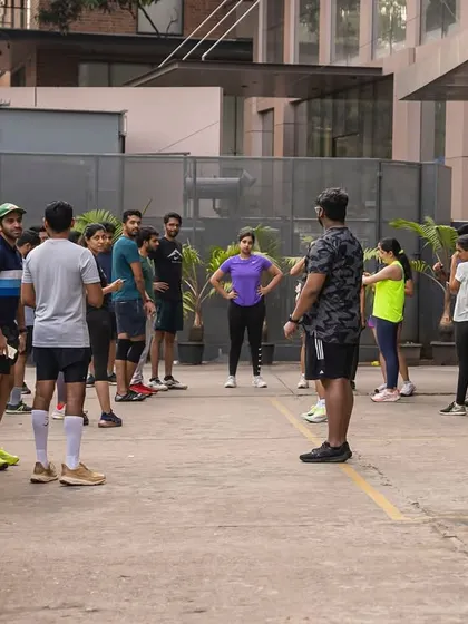 Getting instructions from the coach before we head out. Our runs are structured to provide support and guidance for every runner.