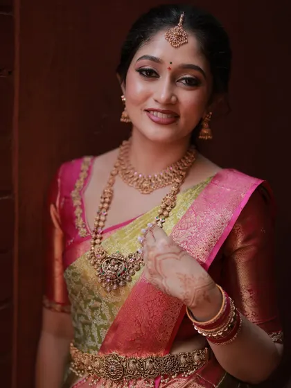A close-up view of the bride's makeup. Note the soft, blended eyeshadow and the precise lip line, details that make all the difference for a polished look.