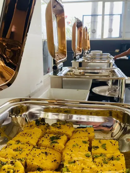 A close-up of the delicious food served at a corporate buffet. We ensure every dish is prepared to perfection and presented beautifully.