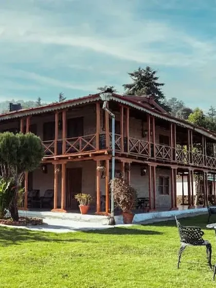 Another daytime view of the lodge and its manicured lawn, a key amenity for the property.