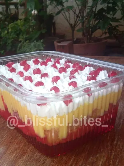 My Mixed Fruit Trifle, a layered dessert that's always a hit at parties. It's packed with fruit, jelly, and custard for a delightful treat.