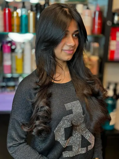 Look at the bounce and movement in this long layered haircut. It’s a perfect solution for managing thick hair, making it feel lighter without sacrificing length.