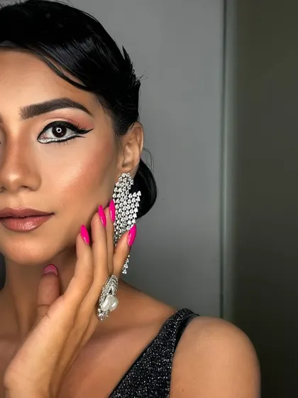 Different angles of the same striking look, showcasing the precision of the graphic eyeliner and the flawless, airbrushed-quality skin. This is a testament to the skills I teach my students.