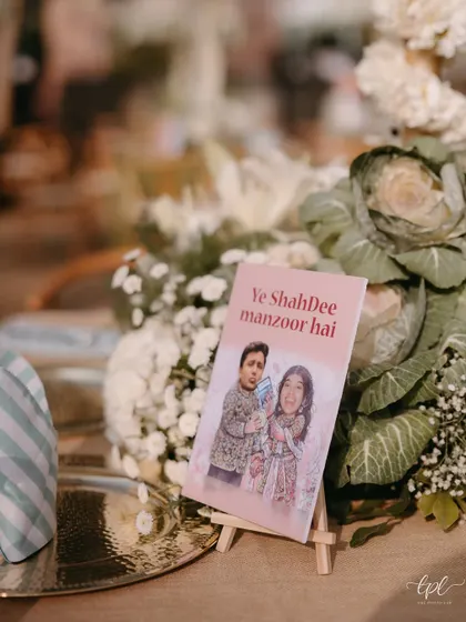We believe your wedding should feel like you. This custom placard with the playful phrase 'Ye ShahDee manzoor hai' is a perfect example of how we weave your personality and inside jokes into the decor, making the celebration uniquely yours.