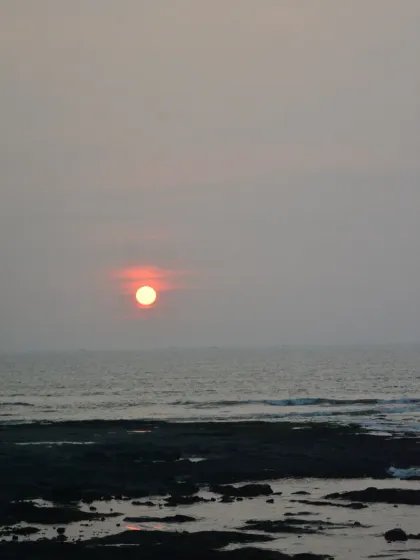 A beautiful, hazy sunset over the sea as seen from our park. The gentle waves and the soft glow of the sun create a moment of pure peace, perfect for ending your day or your workout.