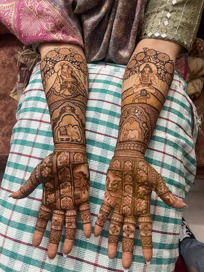 This design combines divine portraits of gods and goddesses on the forearms with intricate geometric patterns on the palms and fingers.