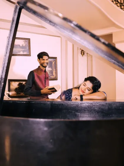 A romantic and artistic photo of a couple by a grand piano. This setup is perfect for couples who share a love for music and the arts.