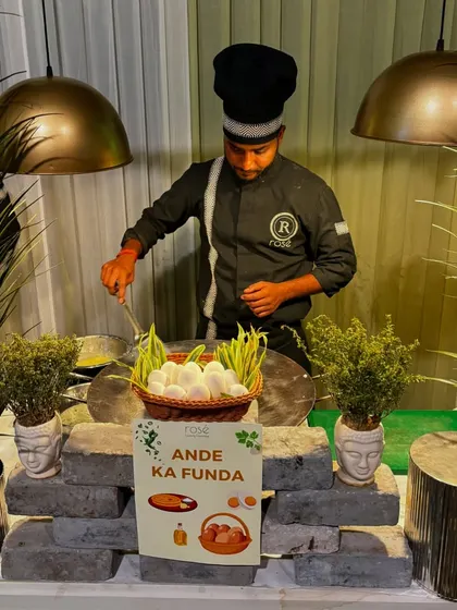Our "Ande Ka Funda" live egg station adds a fun and familiar touch to any event. A chef prepares eggs to order under elegant pendant lighting, offering a comforting and customized option for breakfast meetings or brunch events.