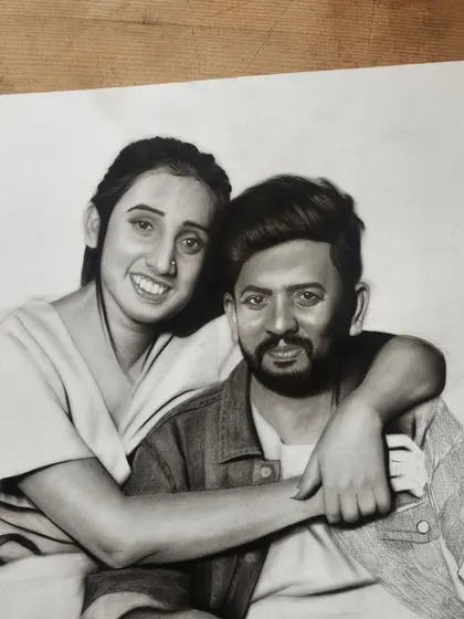 A progress shot of the couple's portrait, showing the detailed shading on their faces and clothing coming together.