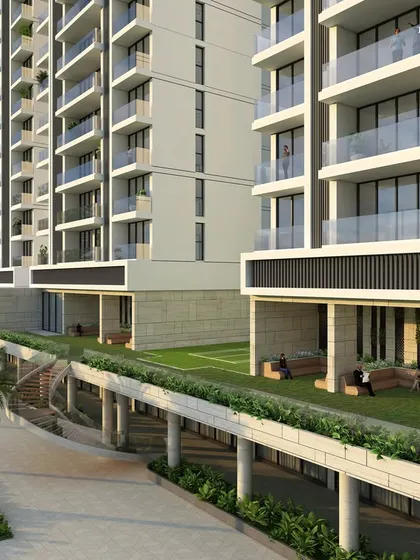The landscaped amenity deck at our Nashik project, featuring green lawns and integrated seating. This space is part of a comprehensive offering that includes a 10,000 sq. ft. gym, gaming zones, and multiple sports courts.