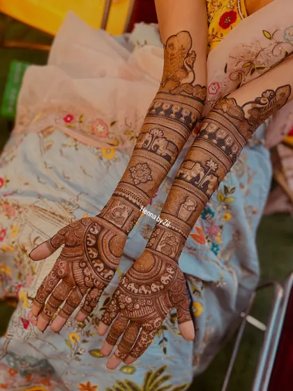 This bride wanted a classic design filled with traditional elements. I incorporated elephants, a doli (palanquin), and other auspicious symbols into her full bridal mehendi.