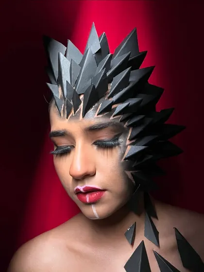 This image captures a softer, more contemplative mood, showing the versatility of even the most dramatic fantasy makeup.