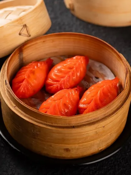 These vibrant red, leaf-shaped dumplings are visually striking. A unique item like this needs a high-quality photo to encourage customers to try something new.