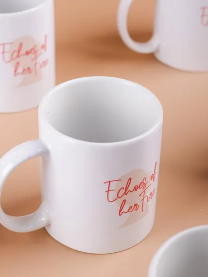A batch of custom-printed mugs with the message "Echoes of Her Fire," created for Hyundai's Women's Day celebration.