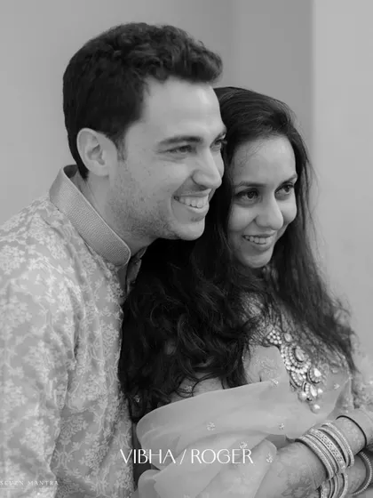 A classic black and white portrait that focuses purely on the couple's joyful expressions and connection.