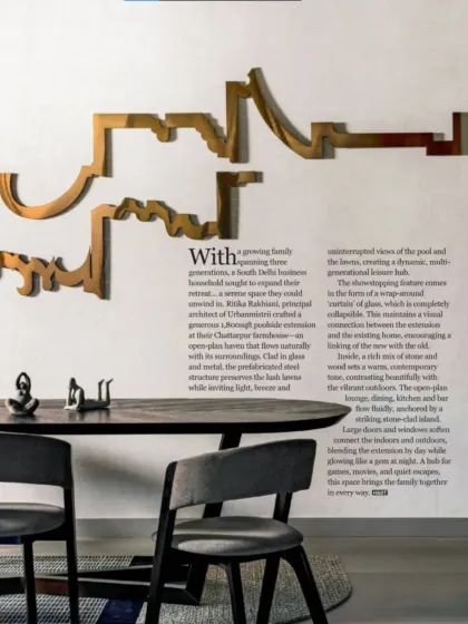 In the dining area, a custom metal art piece adorns the wall, adding a sculptural element that complements the clean lines of the furniture. The open plan ensures a constant connection to the living area and the views beyond.