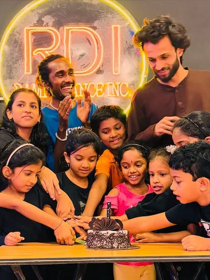 Everyone gets to be a part of the celebration. Here, our instructors and students cut the Children's Day cake together, reinforcing our sense of community and teamwork.