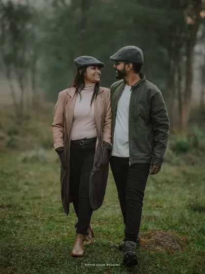 Ananthu and Sarga walking and talking in the woods. This shot feels like a still from a movie, capturing a natural and unposed moment in their story.