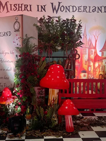 The Wonderland entrance at night, with dramatic lighting enhancing the magical feel.